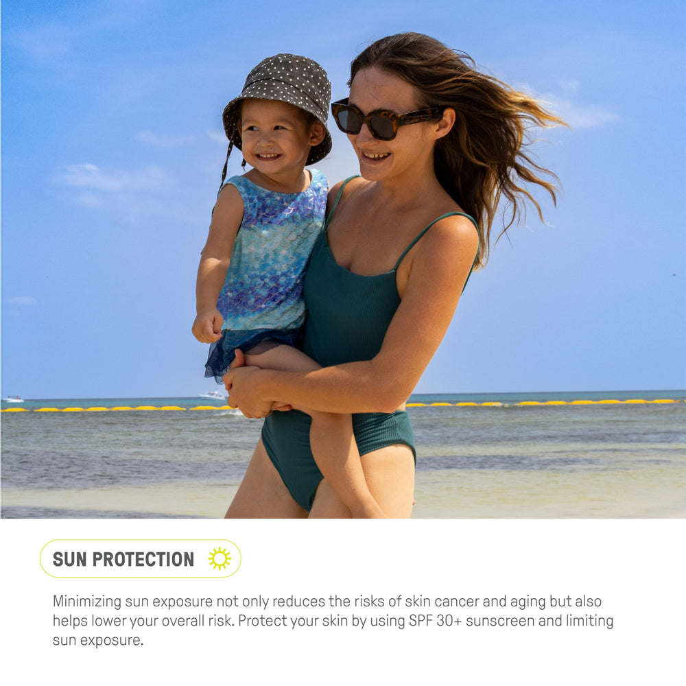 Raw Elements sunscreen tin being applied to skin as a demo.