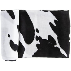 RED ROVR Moo Cow swaddle blanket with playful print for soothing newborn cuddles.