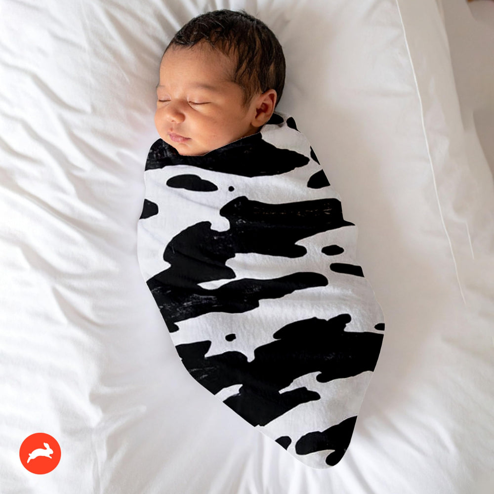 RED ROVR Organic cotton muslin fabric close-up, breathable and gentle on baby skin.