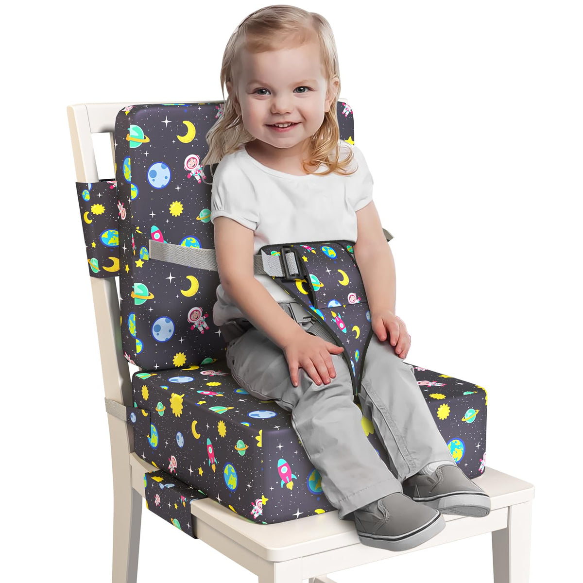 Redcoutt booster seat on dining chair with extended straps for secure fit.