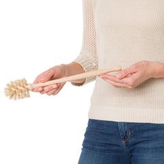 Redecker bottle brush highlights German craftsmanship in durable wooden design.