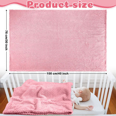 Reginary pink baby blankets folded to show soft coral fleece for warmth.