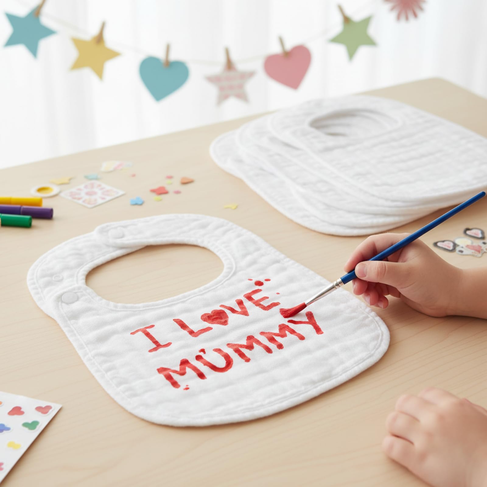 Reginary baby bibs are DIY decorating ready for personalized keepsake gifts.