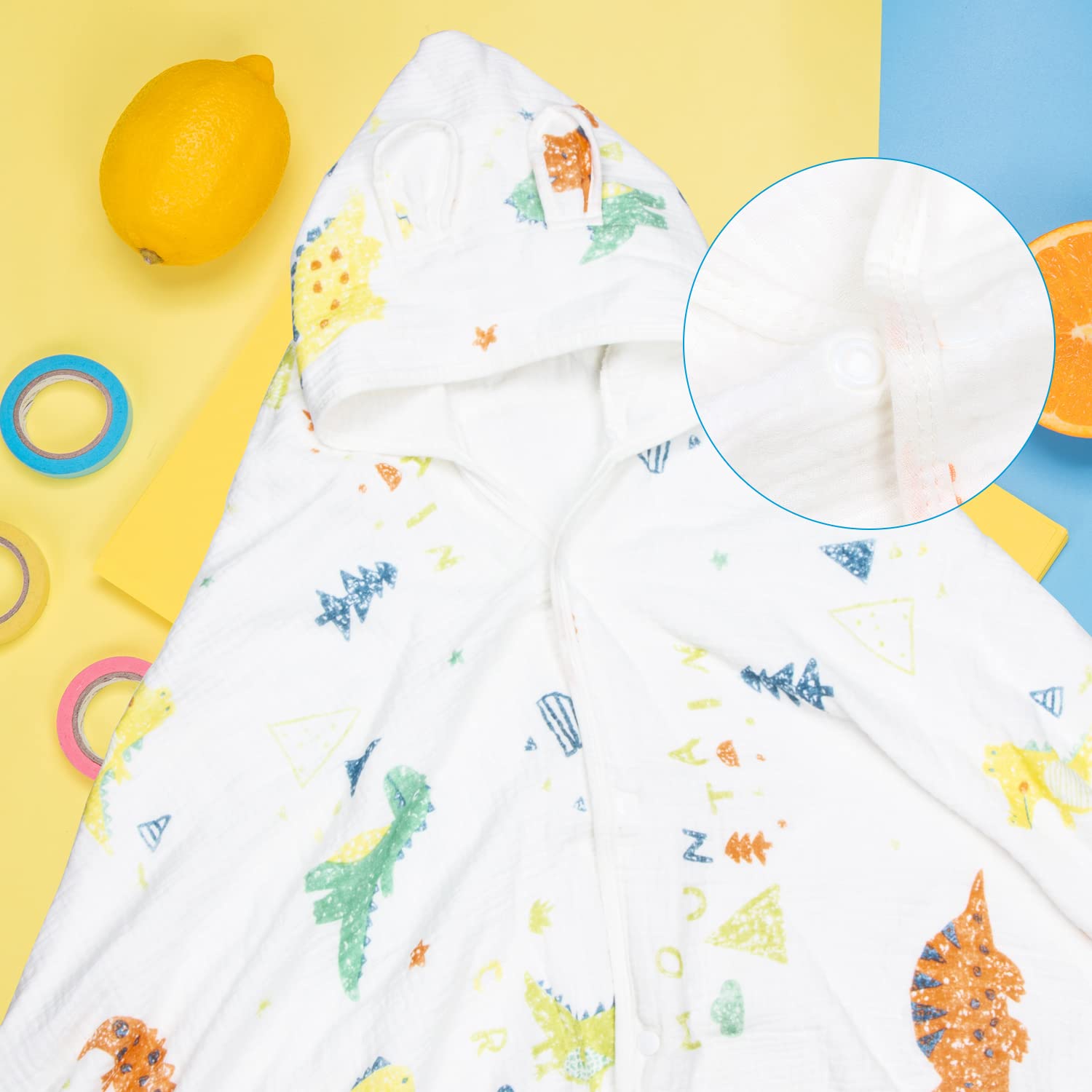 REMASS poncho-style hooded towel shows versatile wear at home or beach.