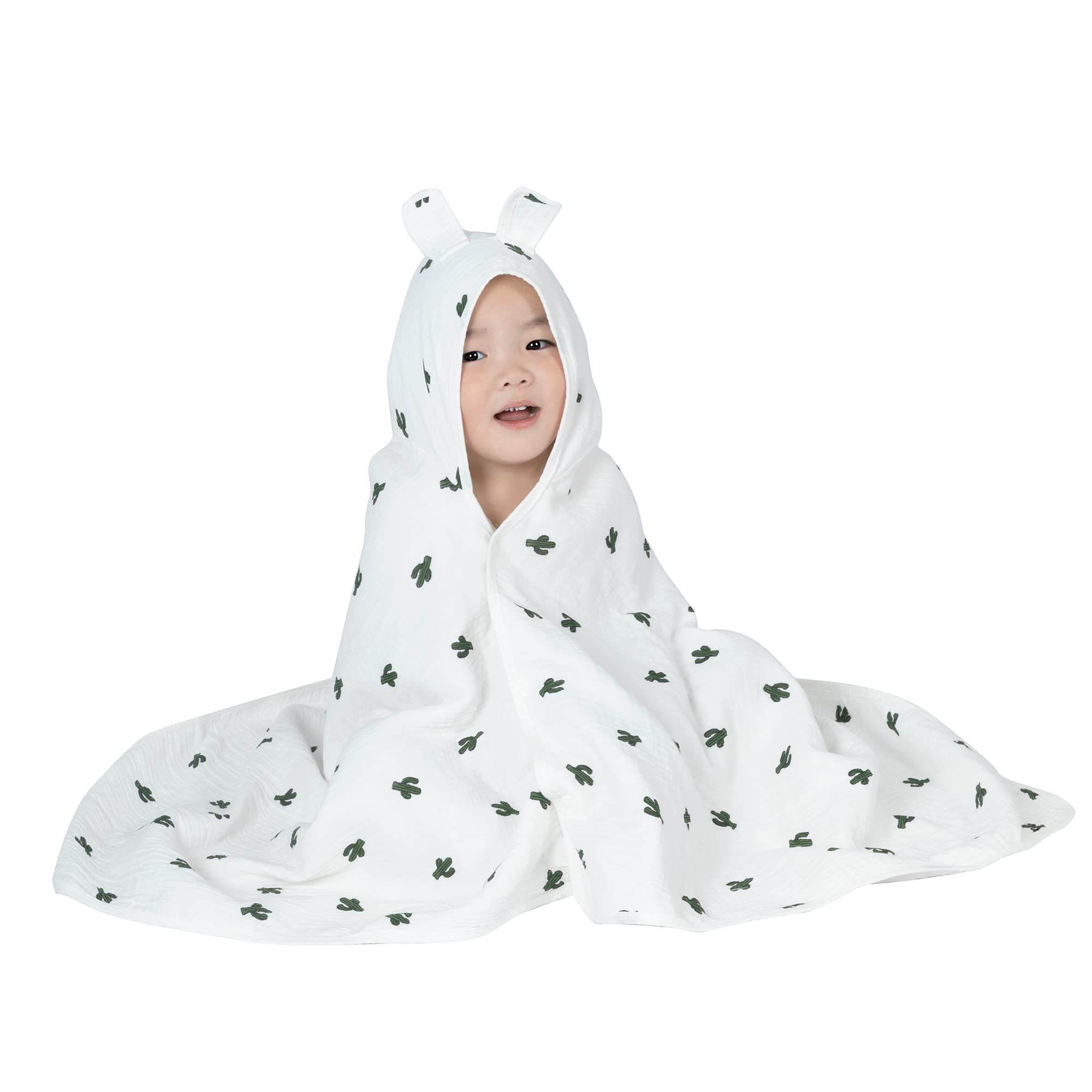 REMASS hooded towel worn as poncho for easy bath-to-play transition.