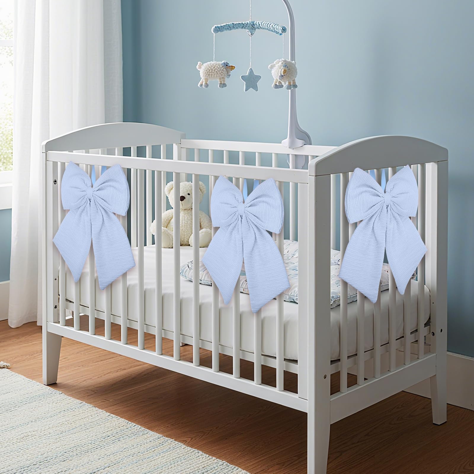 Riceshoot Coquette blue crib bow tied to crib rail for easy use