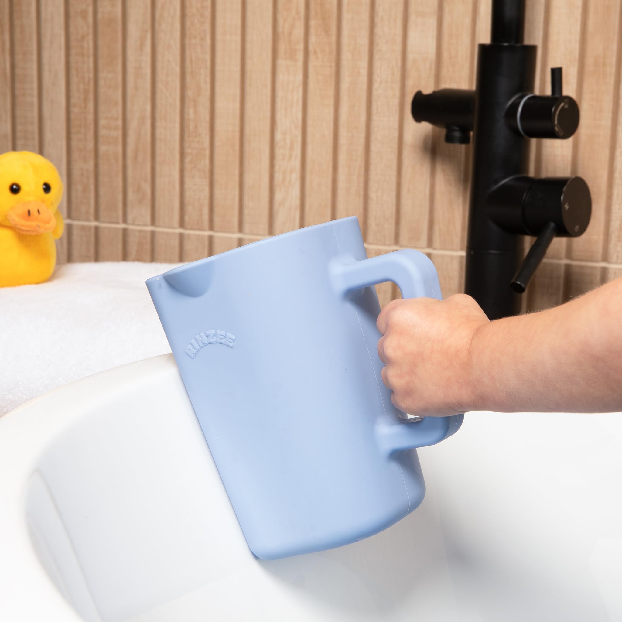 Rinzee bath time setup featuring the cup attached to tiles for easy access.