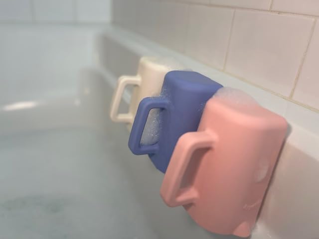 Rinzee drains water upside down capability illustrated with cup tilted over tub
