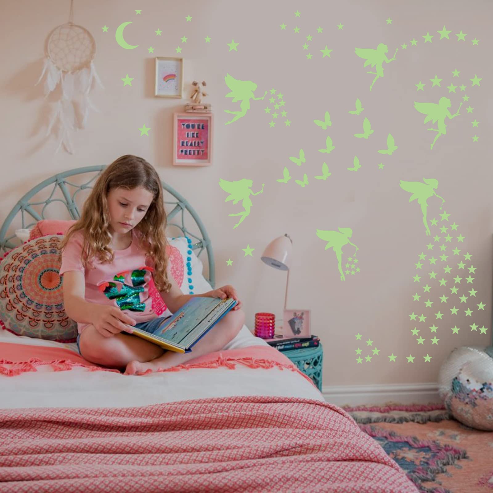 Robmoda butterfly star wall decals spark imagination in a princess-inspired bedroom.