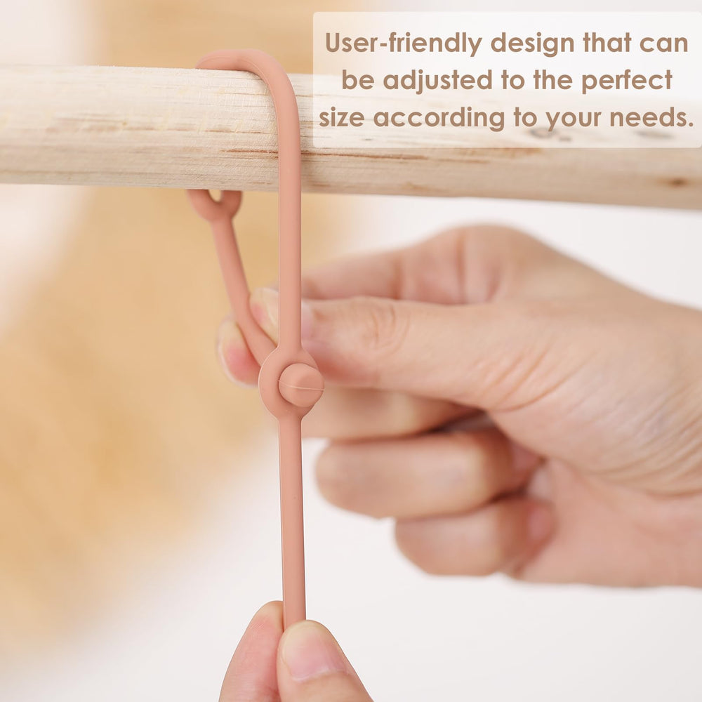 ROCCED Toy Straps in a soft color palette help visual stimulation while securely holding toys.