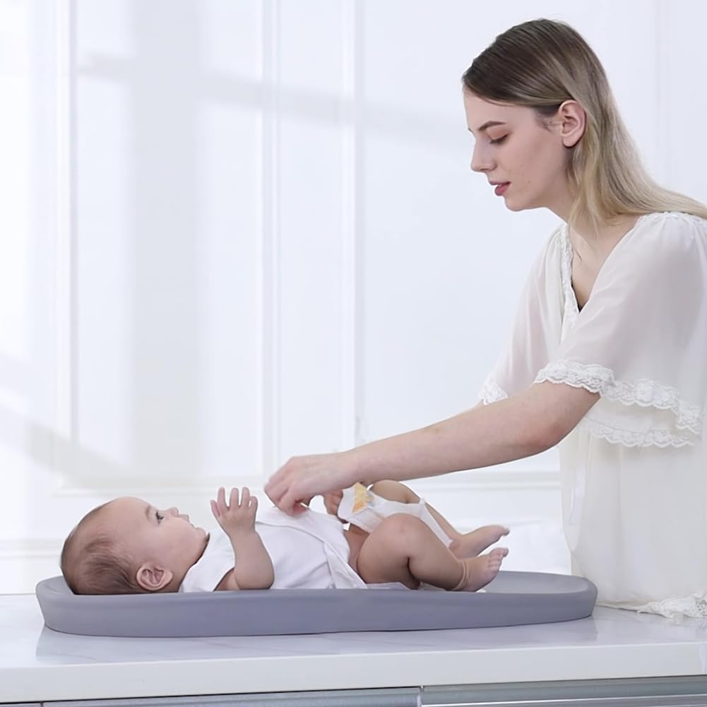 ROGSOUTH changing pad 30x15-6 inches fits most tables securely.