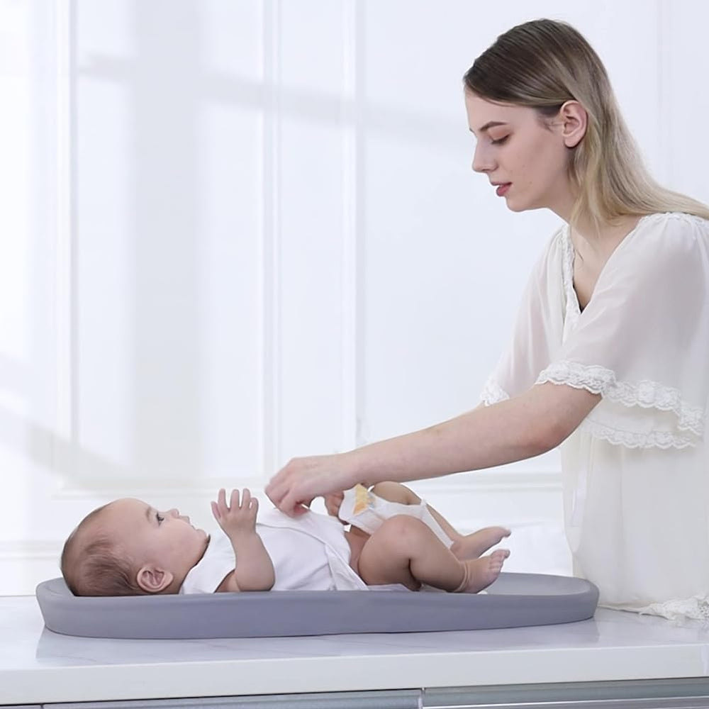 ROGSOUTH changing pad 30x15-6 inches fits most tables securely.