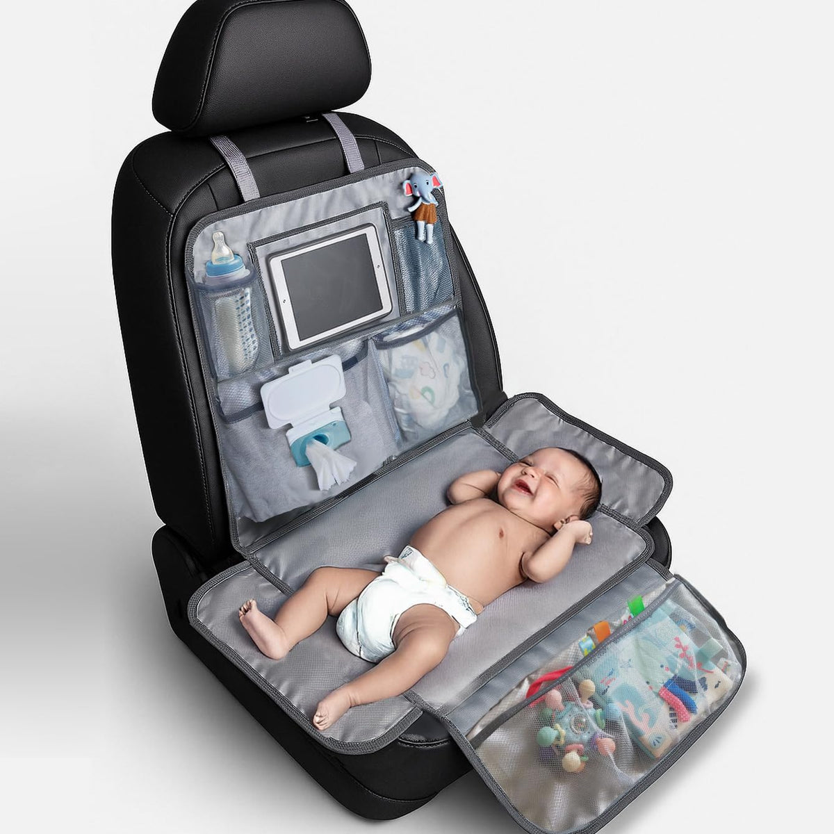 Rohamzen baby changing station folded in car for travel convenience.