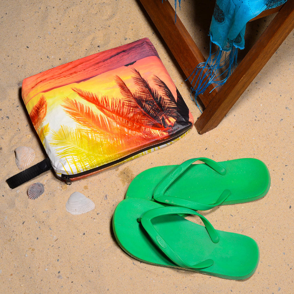 Rolling Nomad Tyvek pouch with strap and snap closure for easy attachment.