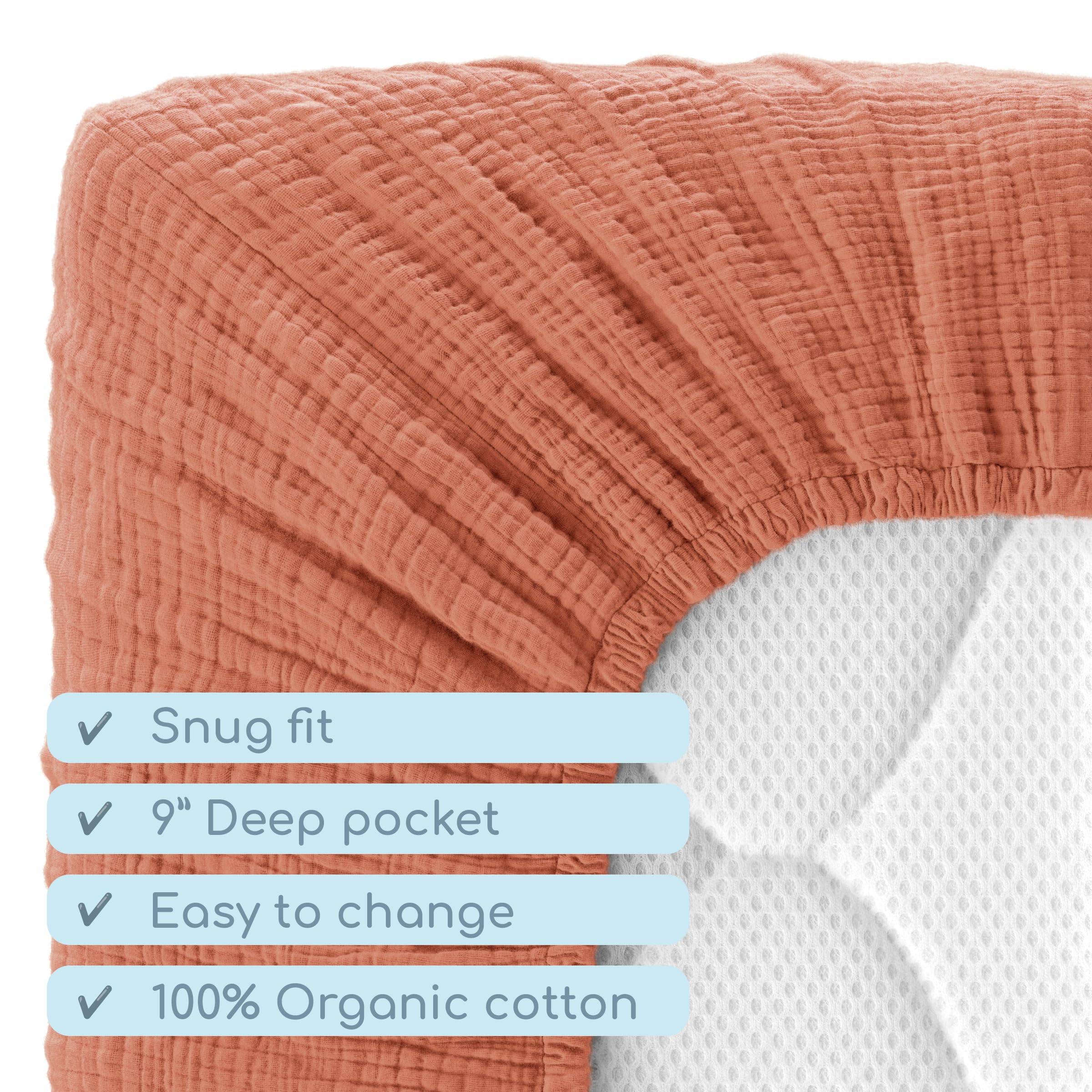 ROMY RO brick-red, gender-neutral crib sheet adds calming nursery color.