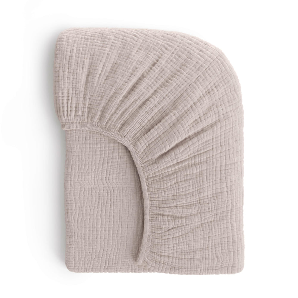 ROMY RO muslin crib sheet close-up showcases soft-touch fabric and breathable cotton.