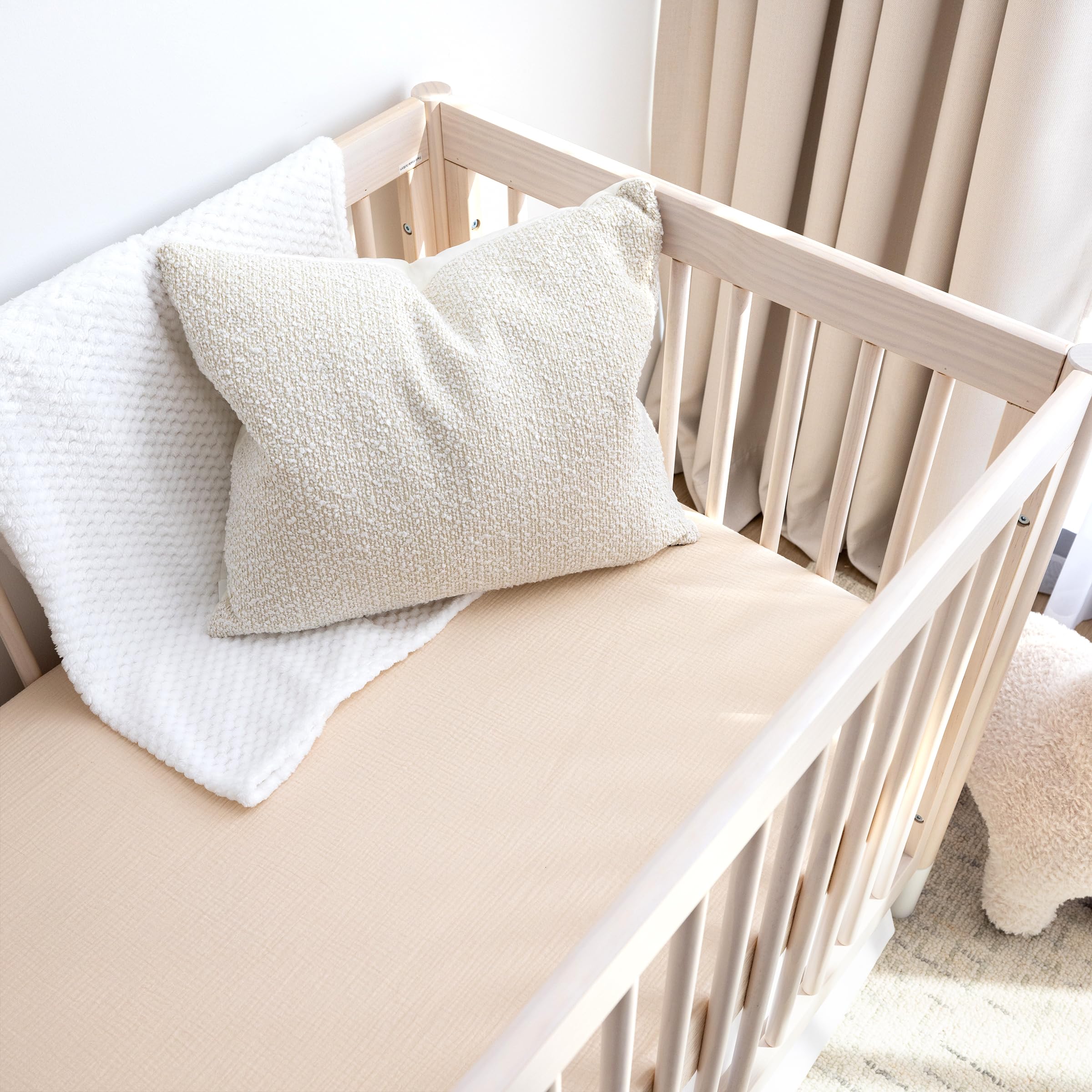 ROMY RO crib sheet in wheat with secure elastic edge for snug mattress cover.
