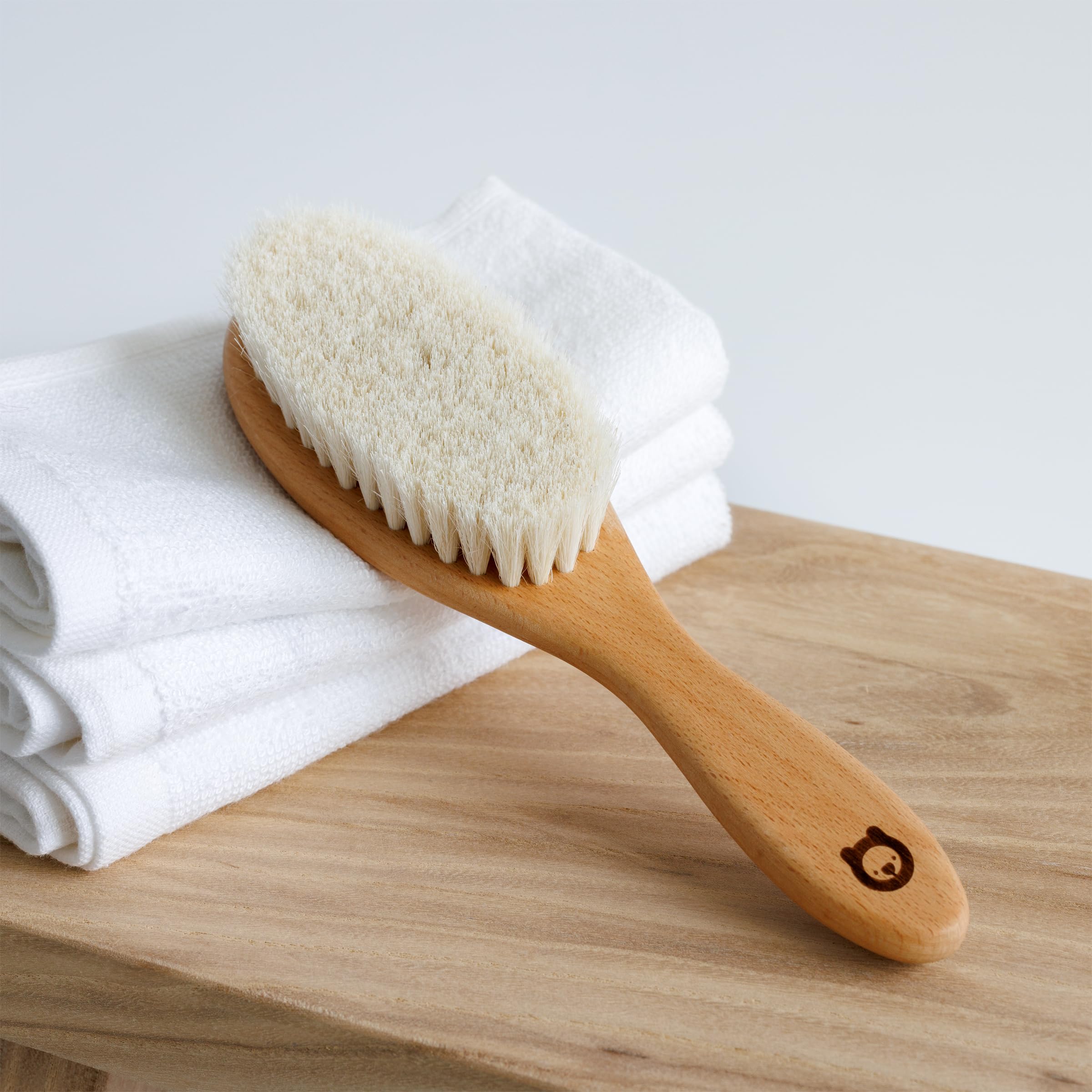 ROMY RO natural bamboo handle detail for safe baby care.