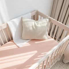ROMY RO muslin crib sheet apricot closeup stitching shows durable seams