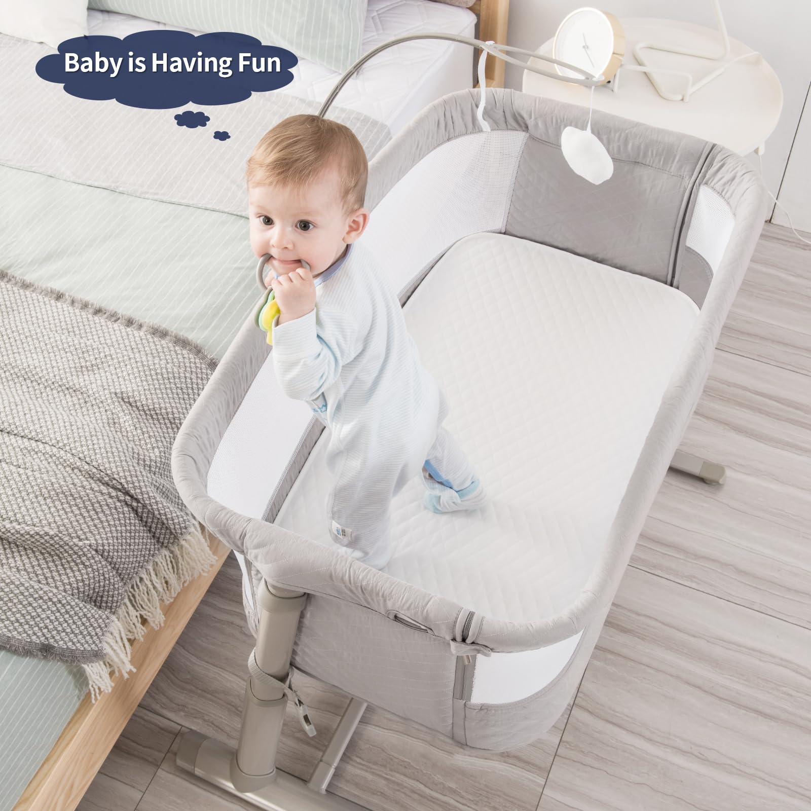 RONBEI height-adjustable bassinet aligns with bed heights for convenient night feeds.