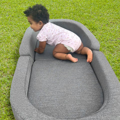 RONBEI travel bed sofa chair in sofa mode used as portable kid seat.