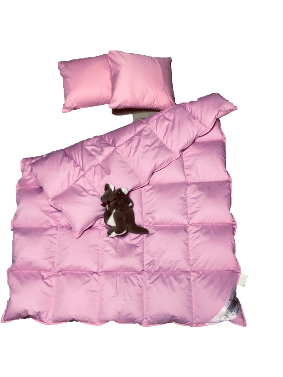 Rose Feather all-season blanket laid on bed with cozy texture