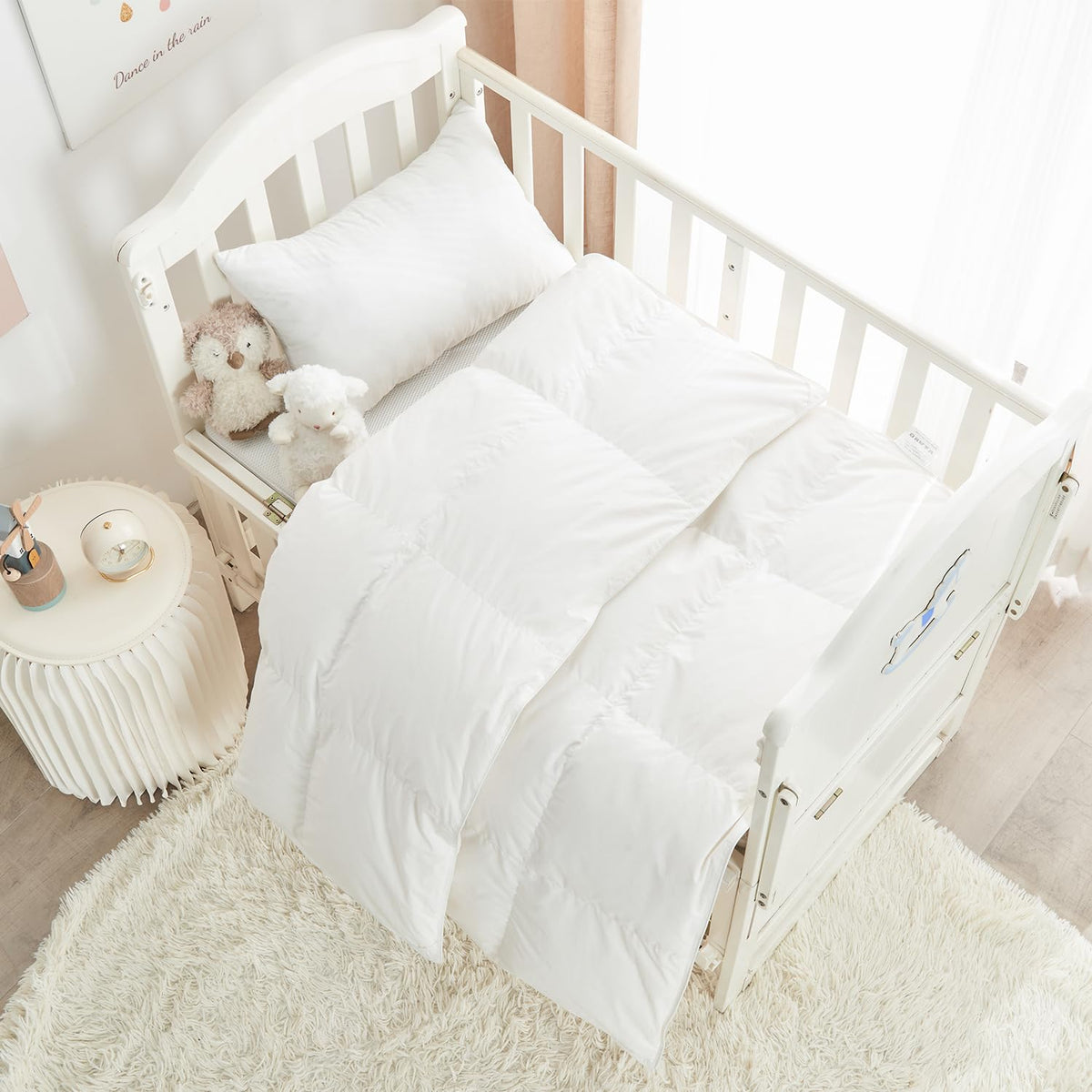ROSE FEATHER down comforter in crib offers all-season warmth