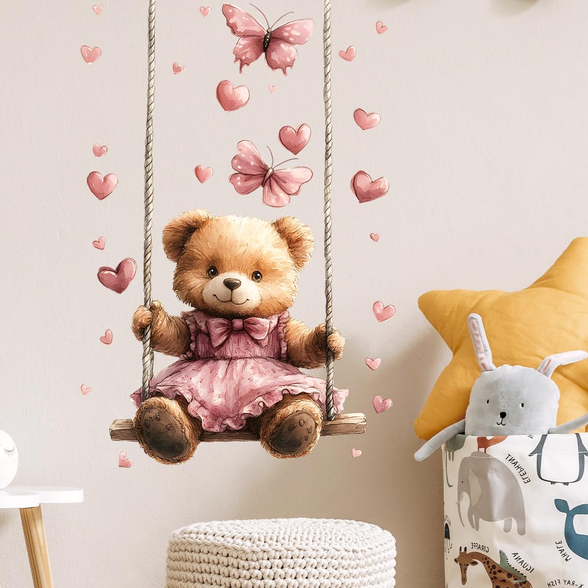 RoyoLam teddy bear wall decal on swing adds playful focal point in playroom.