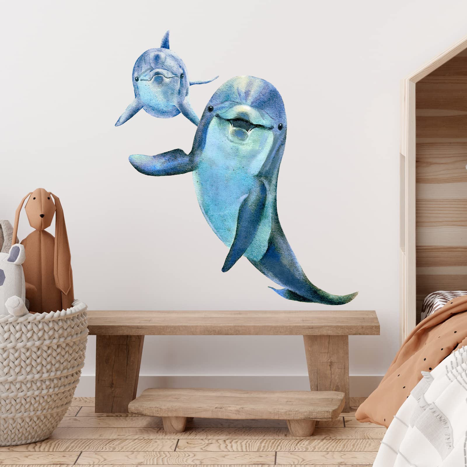 royolam dolphins wall sticker hangs above a crib to inspire bedtime stories.