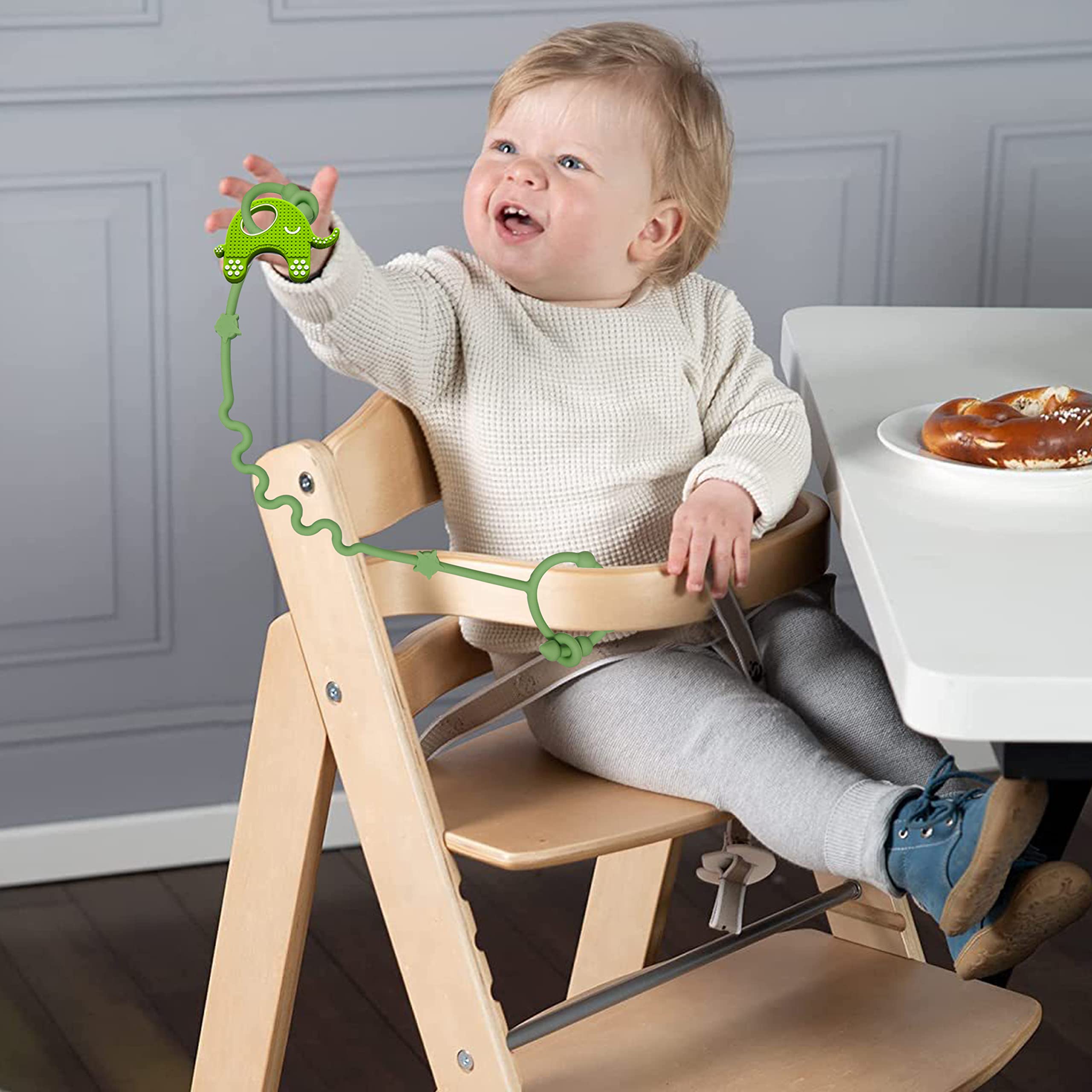 RTMOK car-seat toy strap shows versatile use during travel.