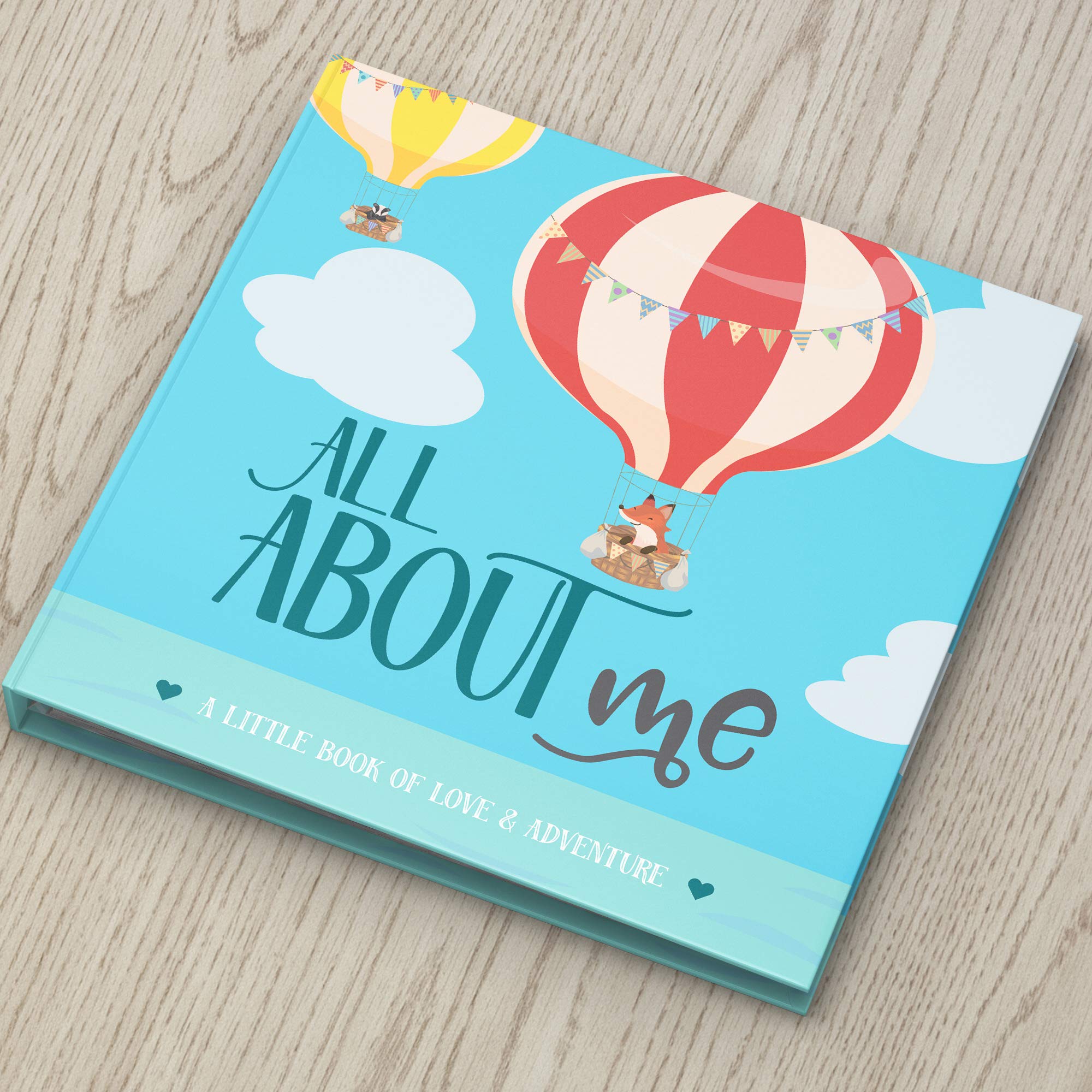 RubyRoo Memory Book inside pages feature milestone prompts and photo spaces for growing memories.