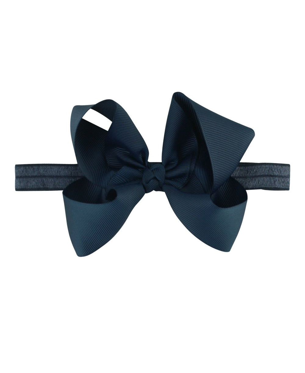 RuffleButts Girls Navy Bow Headband front view keeps hair neatly in place.