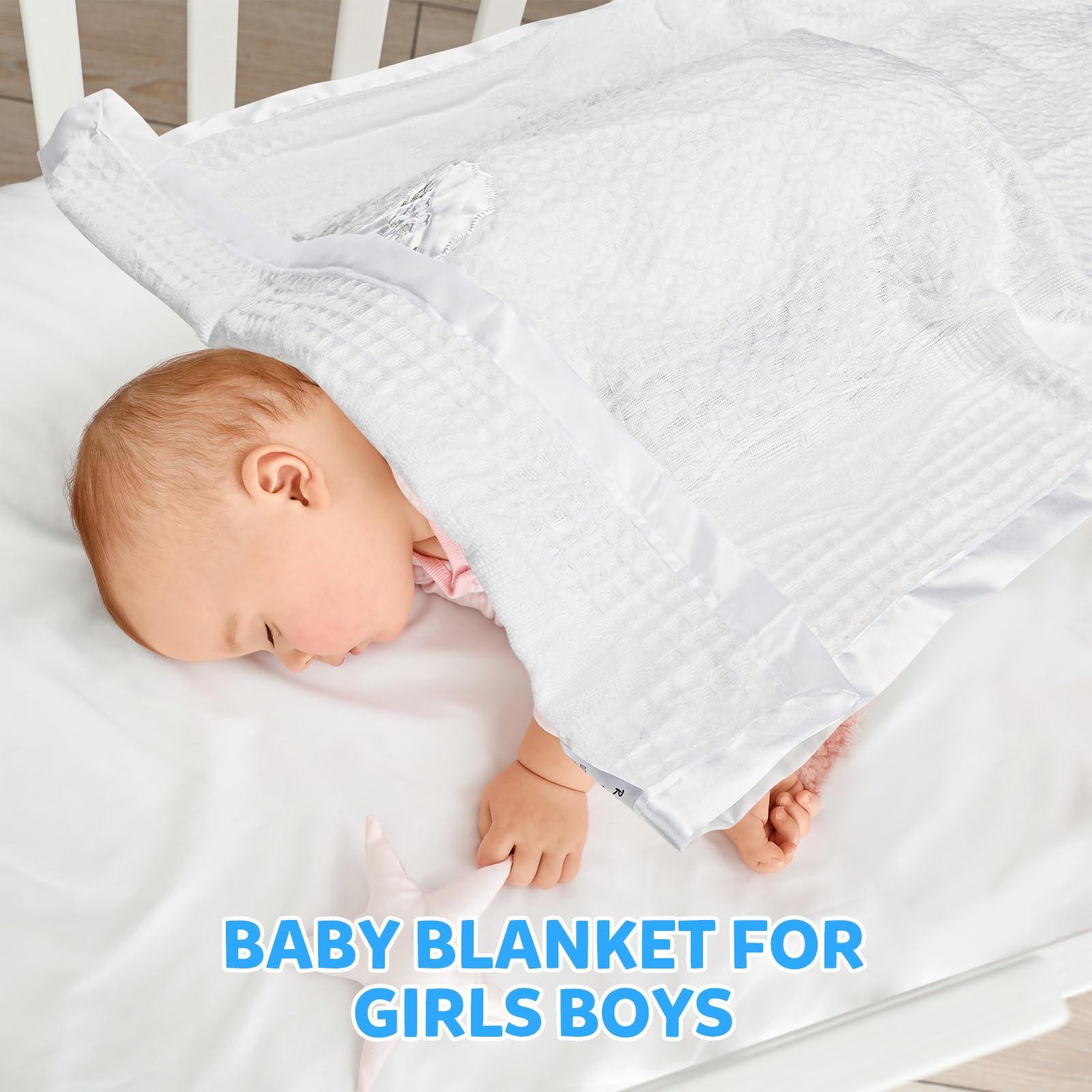 Runeaoys white baby blanket knit with satin border feels soft against delicate skin