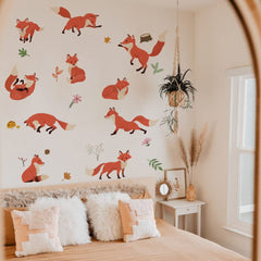Runtoo woodland flowers decal complements fox silhouettes in a calm bedroom.
