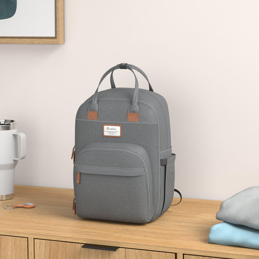 RUVALINO diaper bag backpack insulated bottle pockets keep bottles at the right temperature.