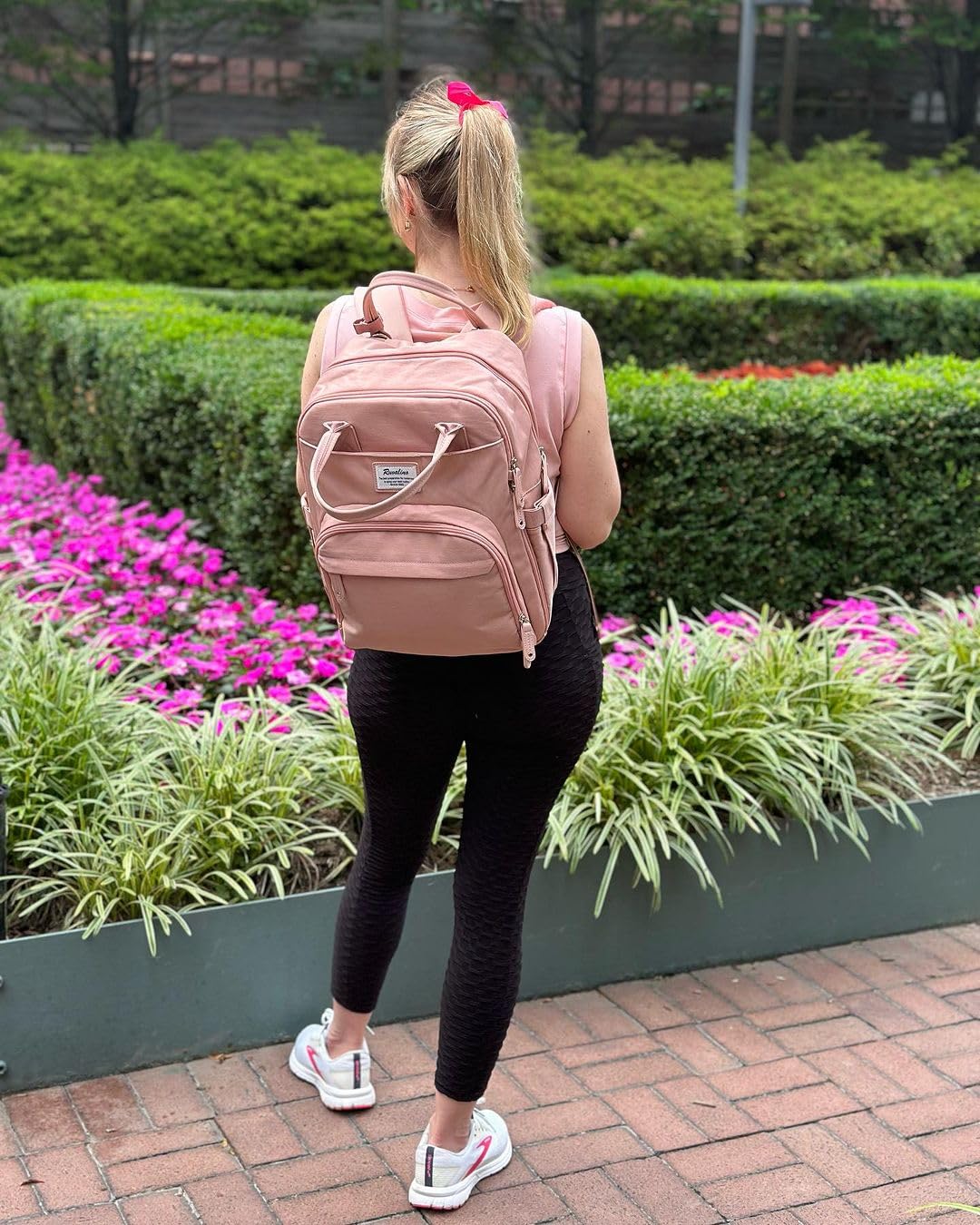 RUVALINO diaper bag backpack pink closeup highlights durable material and color style