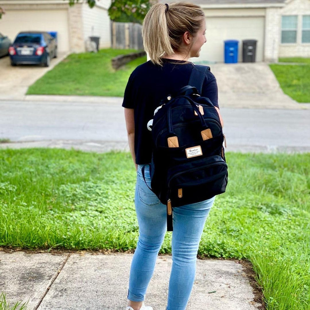 RUVALINO diaper bag backpack waterproof fabric protects against spills and rain