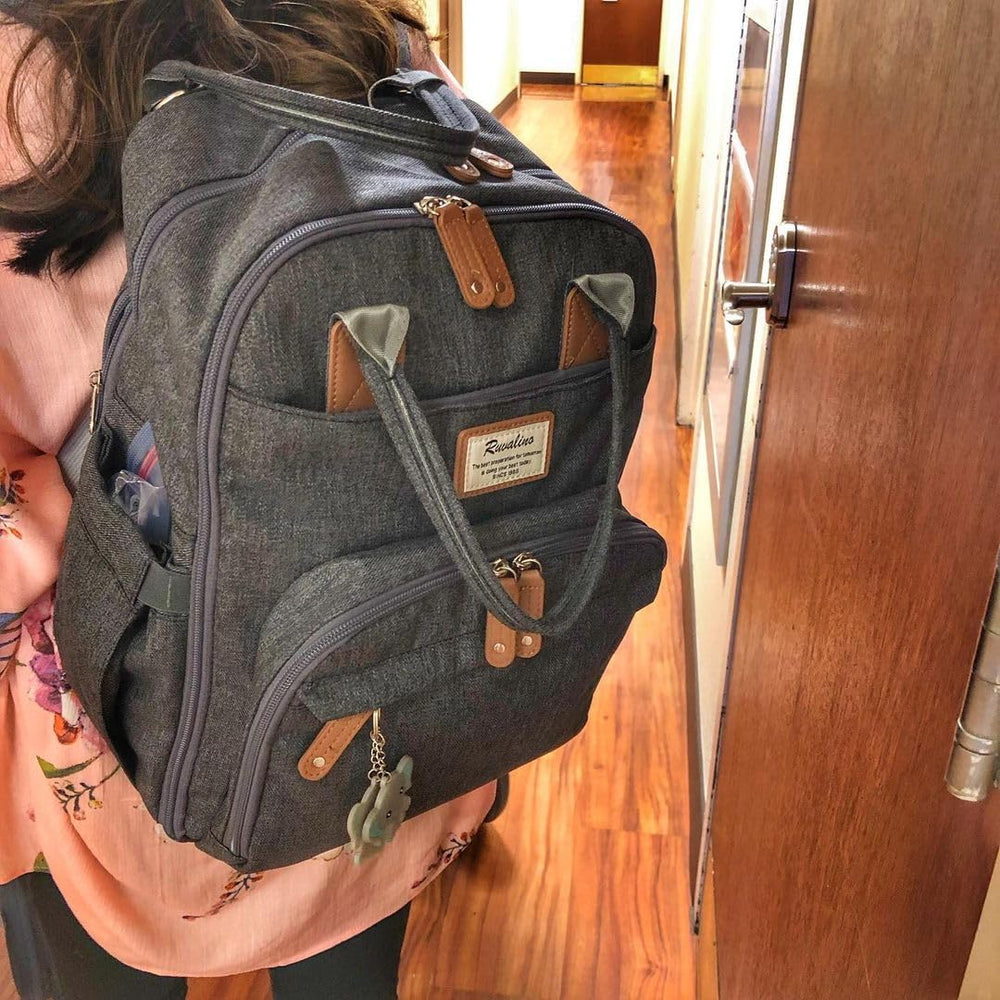 RUVALINO diaper bag ergonomic back panel and padded straps for comfortable carry.