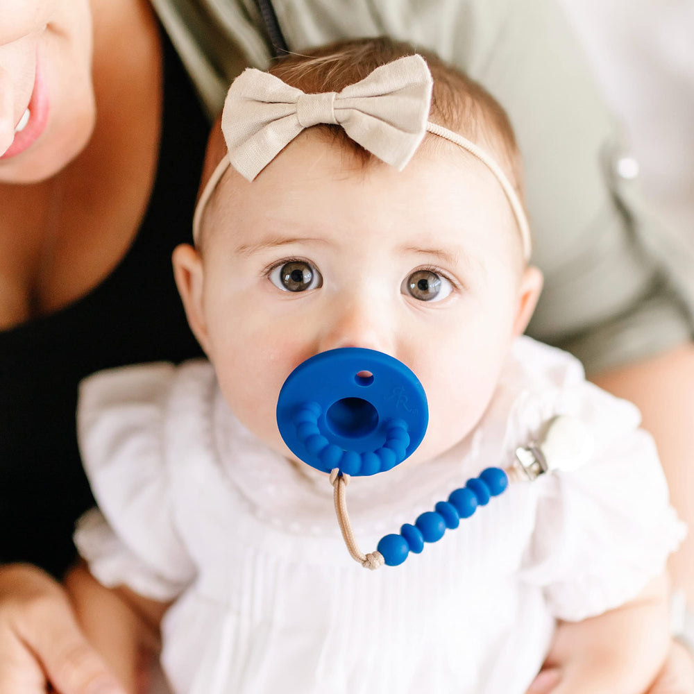 Ryan and Rose Cutie PAT Bulb pacifier top-rack dishwasher-safe scene.