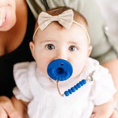 Ryan and Rose Cutie PAT Bulb pacifier top-rack dishwasher-safe scene.