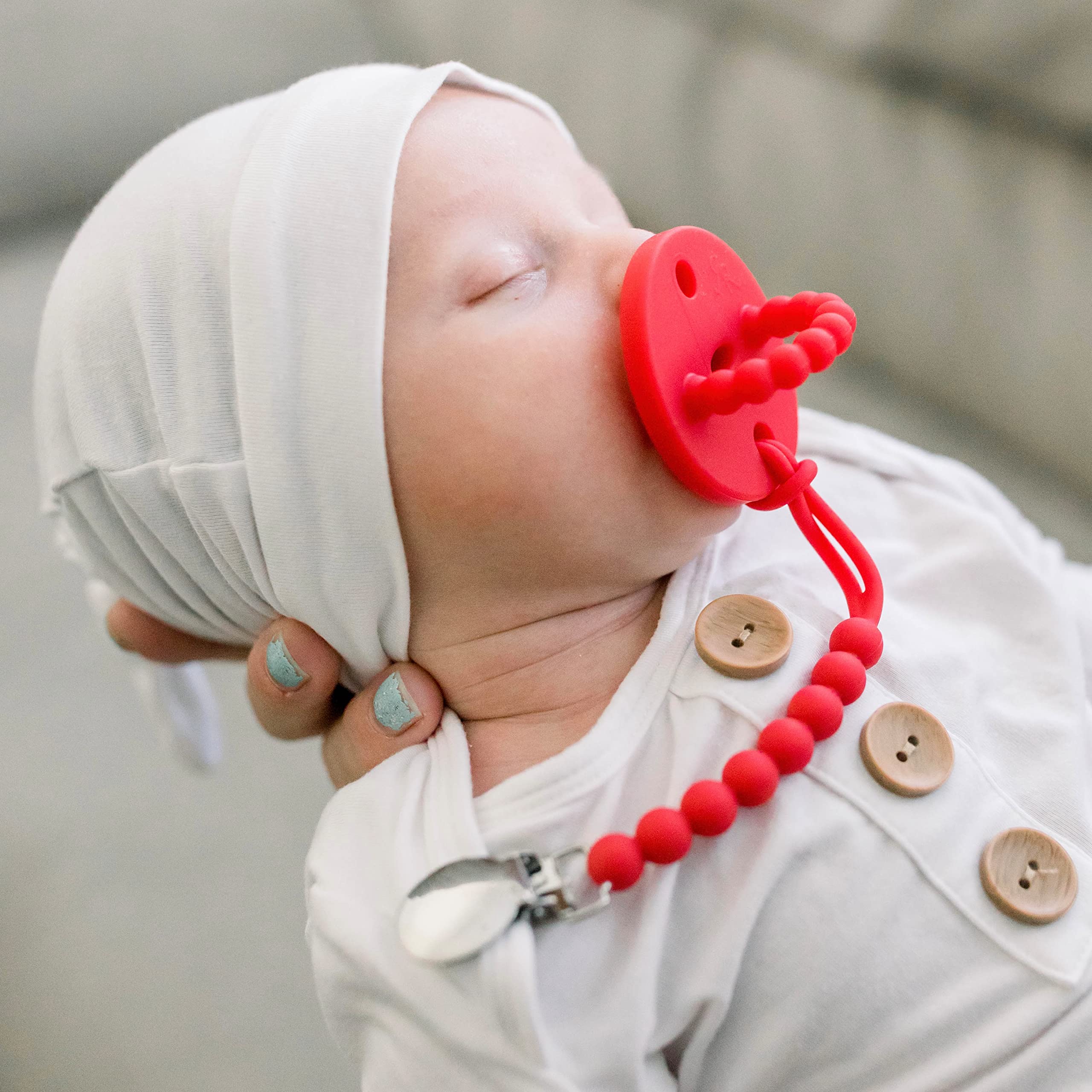 Ryan & Rose Cutie PAT Slant Red close-up of smooth silicone teether texture