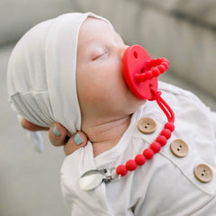 Ryan & Rose Cutie PAT Slant Red close-up of smooth silicone teether texture