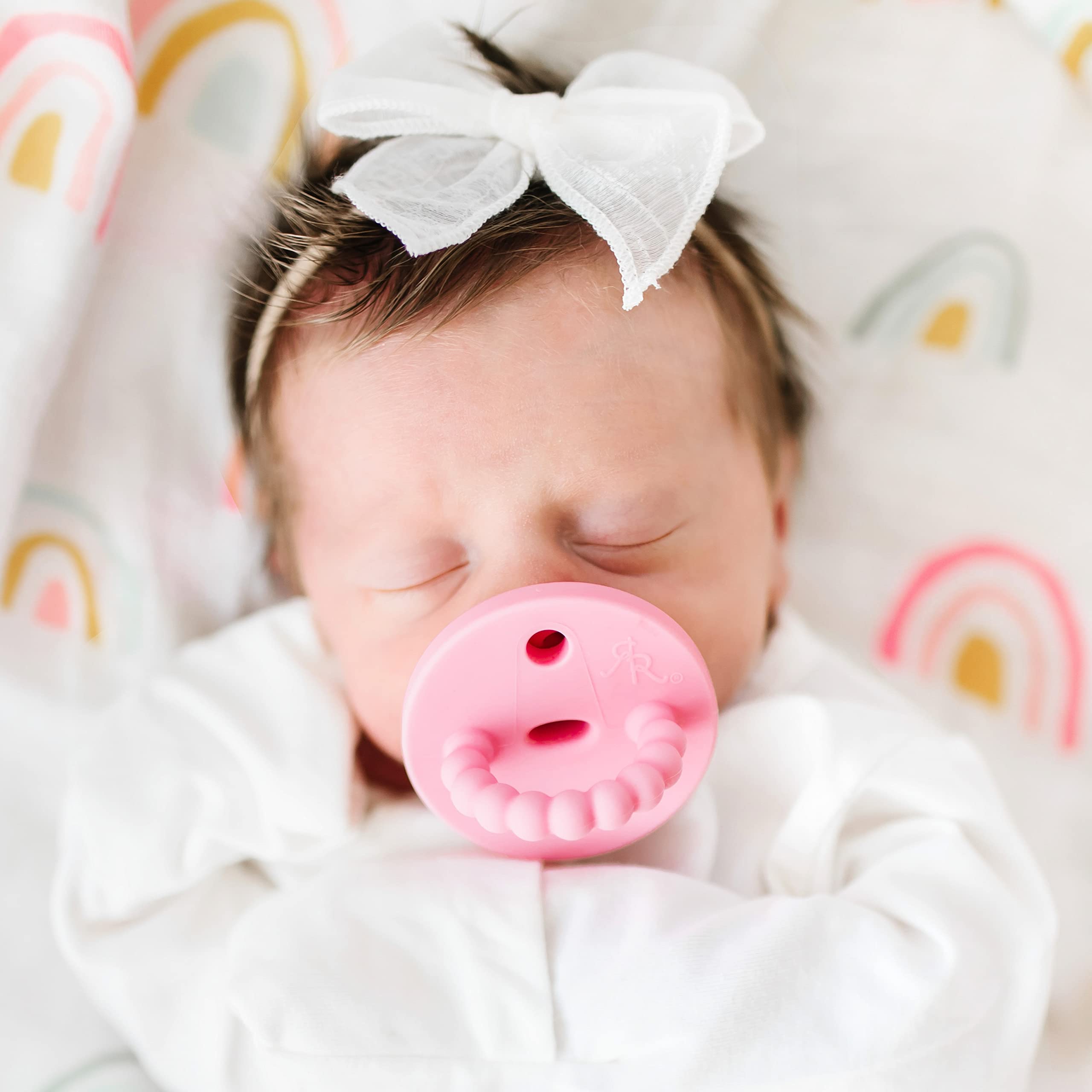 Ryan & Rose Cutie PAT teether featuring nipple tuck-away for compact storage.