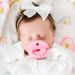 Ryan & Rose Cutie PAT teether featuring nipple tuck-away for compact storage.