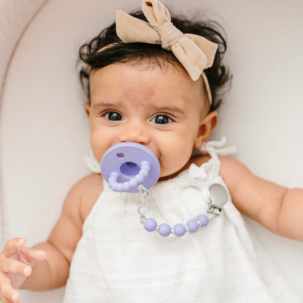 Ryan & Rose Cutie PAT Bliss teether in action for baby gums during soothing