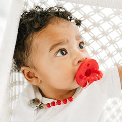 Ryan & Rose Cutie PAT with clip attachment—secure pacifier for on-the-go use.
