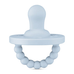 Ryan & Rose Cutie PAT Flat Blue pacifier close-up showing soft silicone nipple for gentle soothing.
