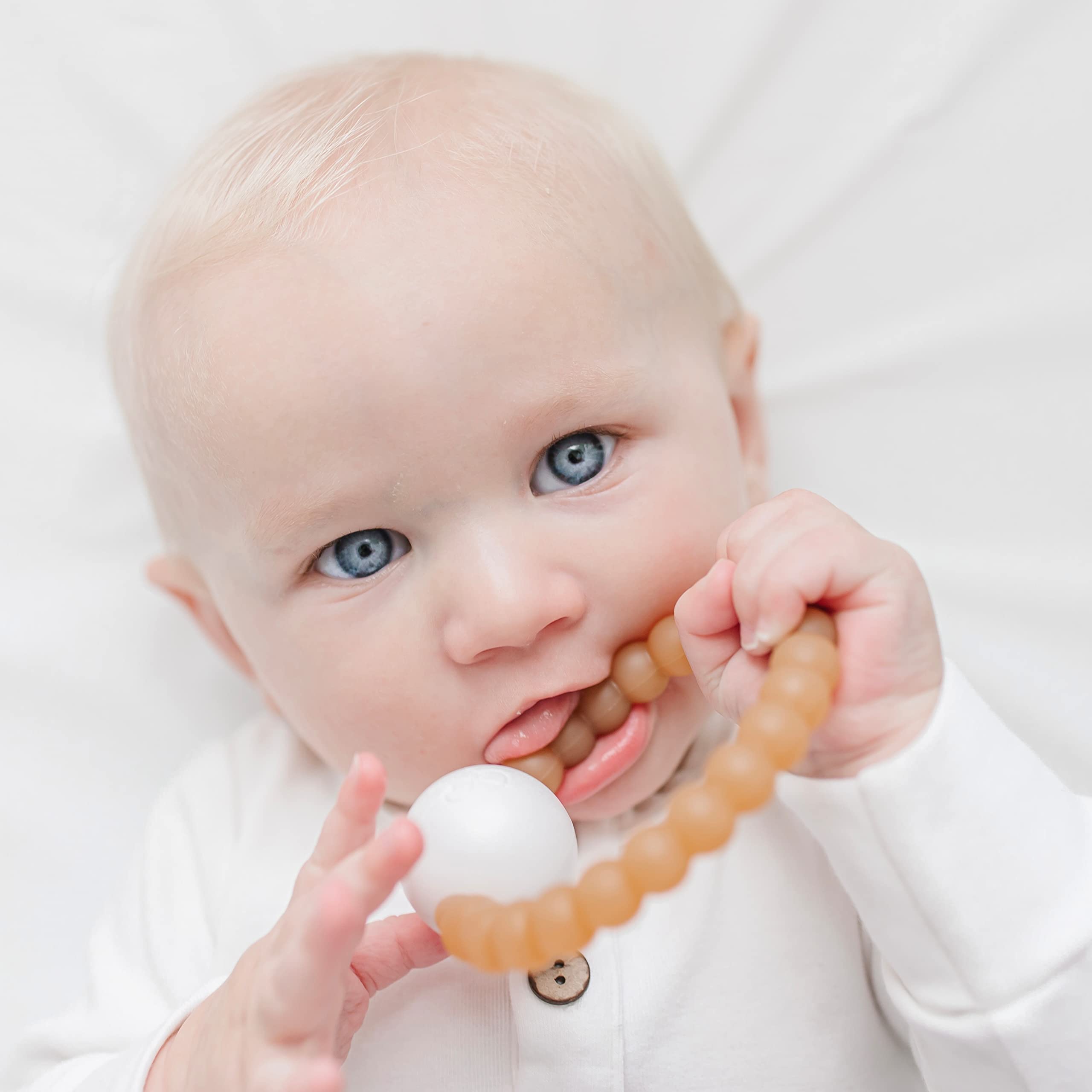 Ryan & Rose Cutie Teether Rattle being cleaned and air-dried for safe care