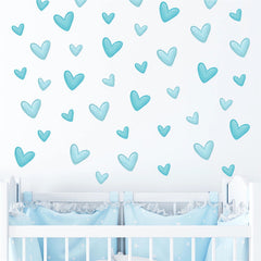 Sacinora blue love heart stickers provide playful nursery decor.