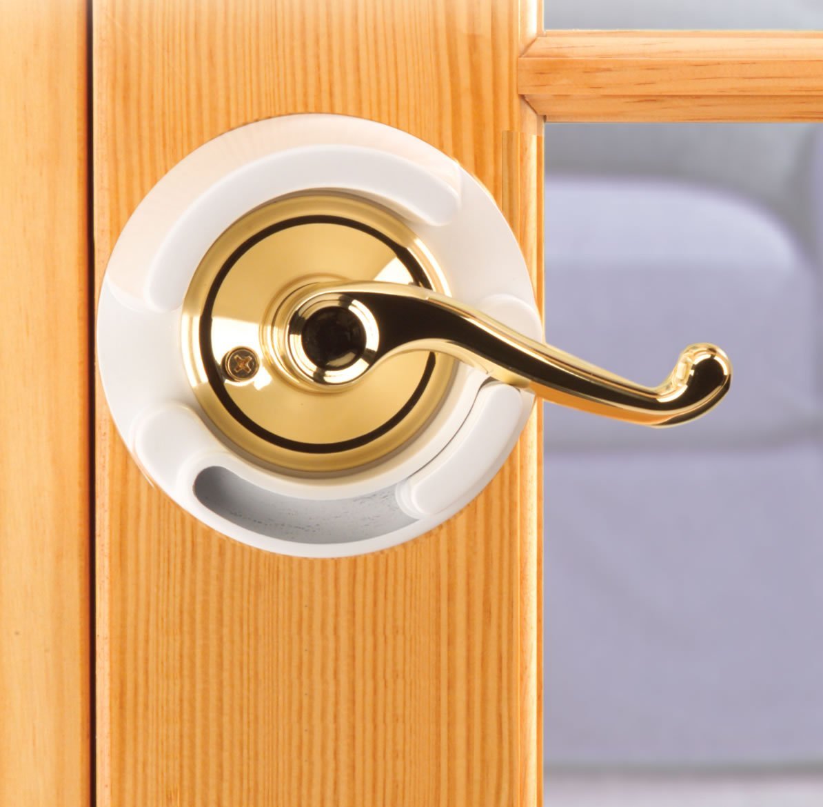 Safety 1st lever lock close-up highlighting press-and-slide operation for adults.